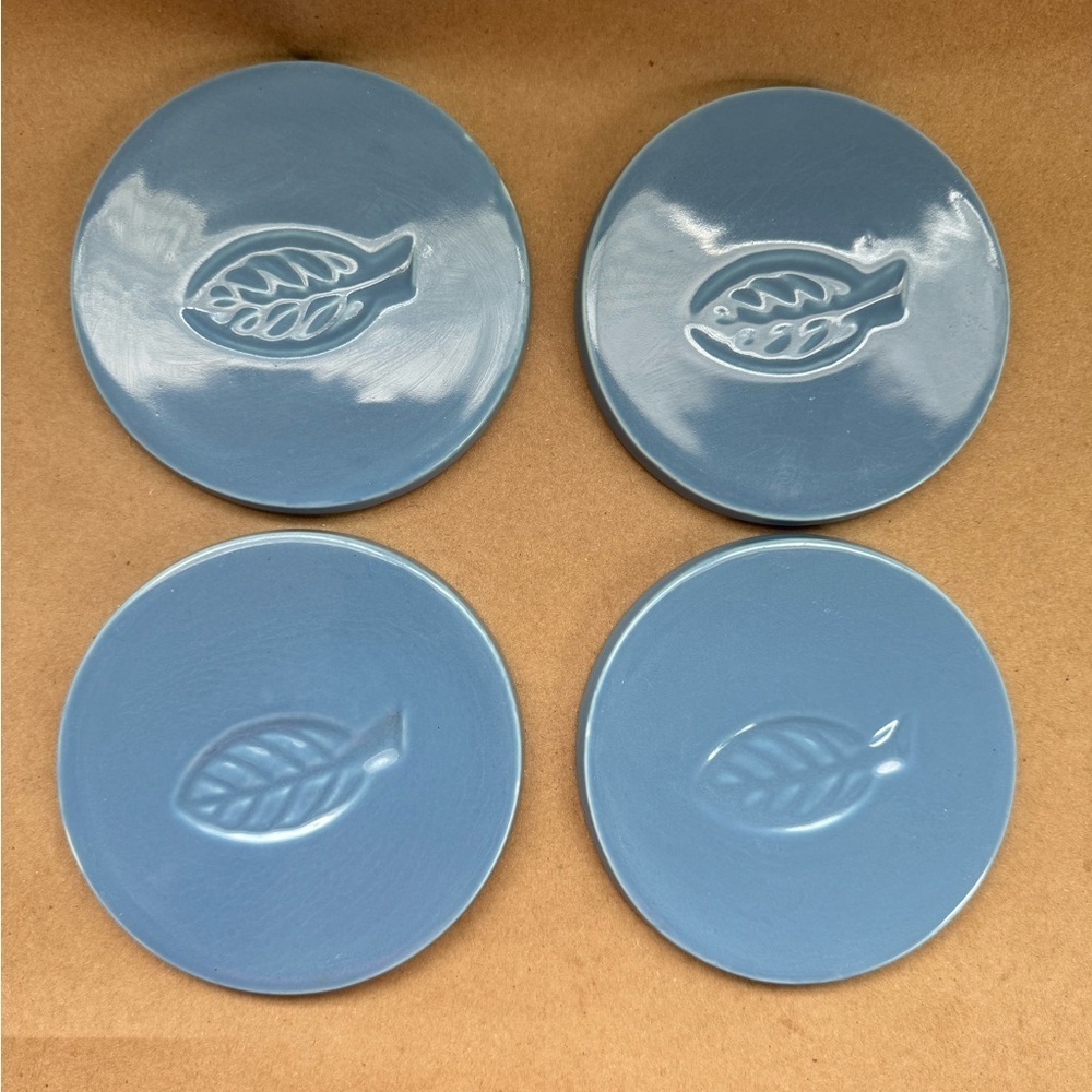 Set of 4 Blue Ceramic Coasters with Leaf Design. 4.5” diameter.